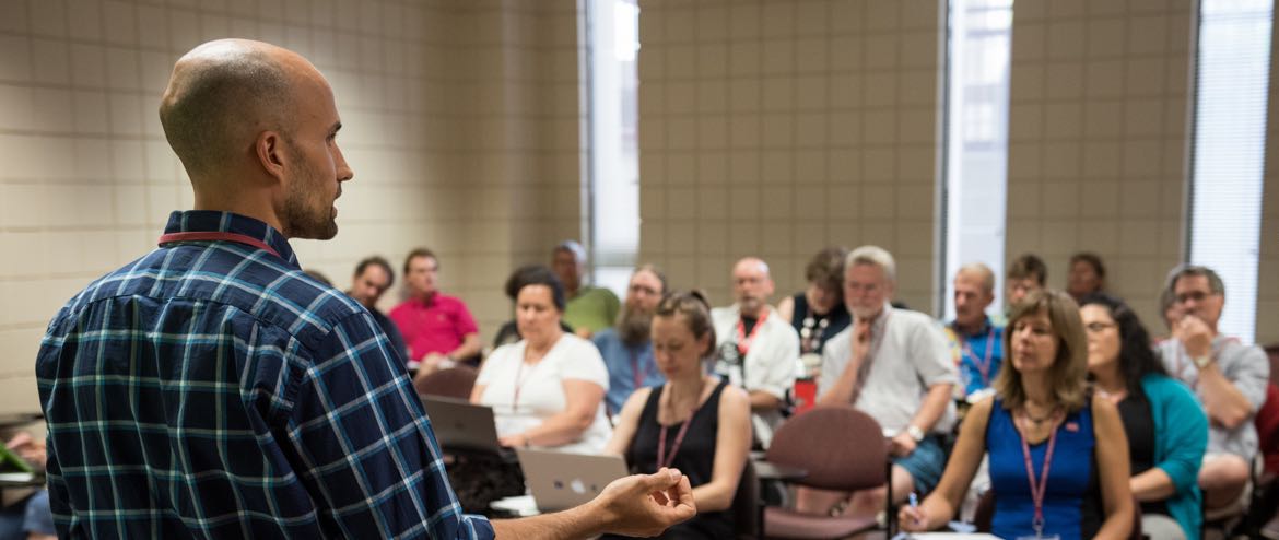 Presenter in front of a session.